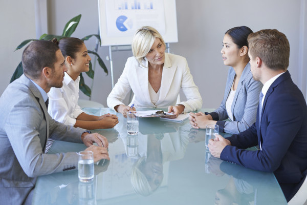 Cropped shot of a group of Heartland colleagues meeting in the boardroom